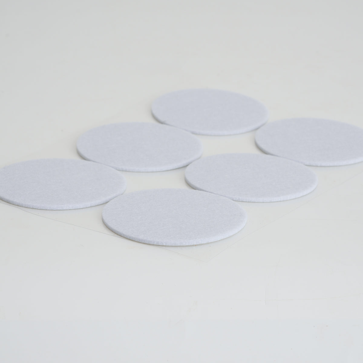 MIcroppose Adhesive Tub Filters on white background